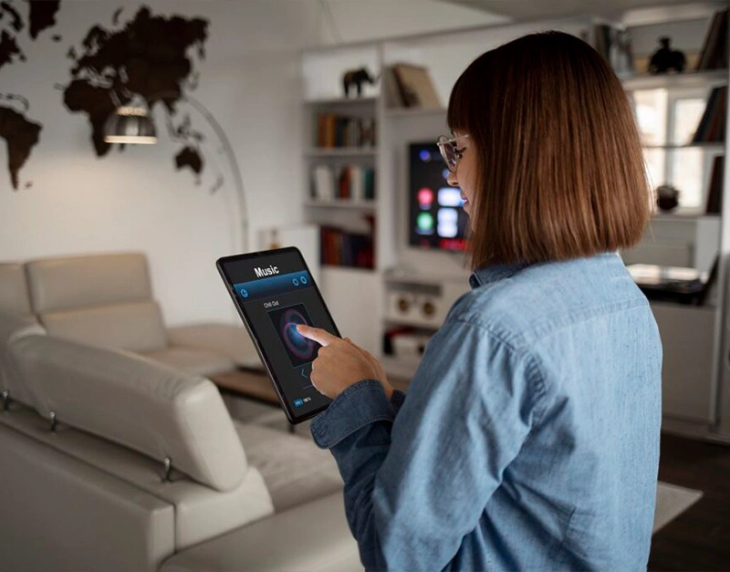 woman is using smart home control by mobile app